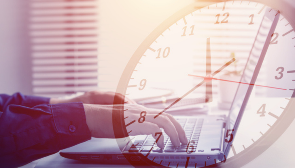 Close-up view of an entrepreneur typing on computer with clock overlapping. concept of effective time management and scheduling
